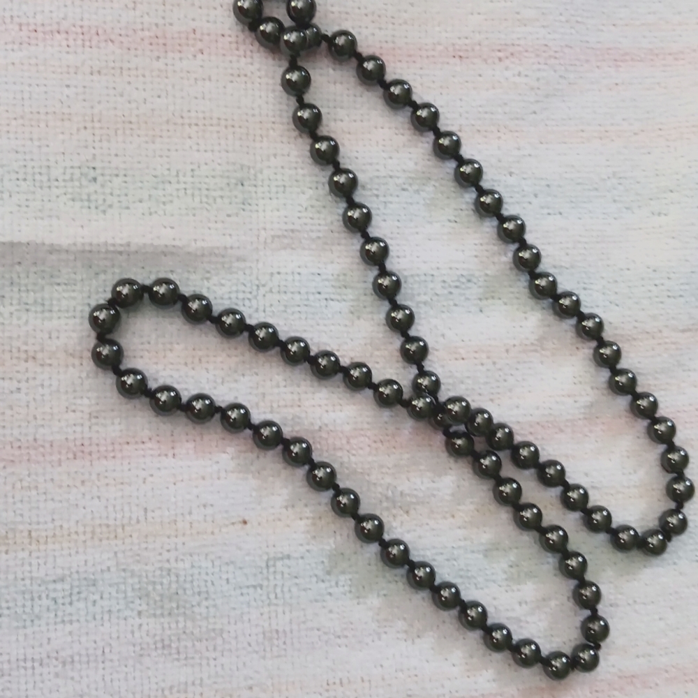 Handstrung Hematite necklace. 32 inches long. Knotted between each bead.